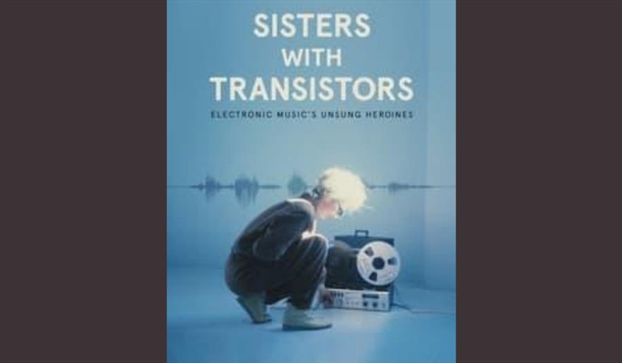 Promotional poster showing a lady crouching over electronic equipment.