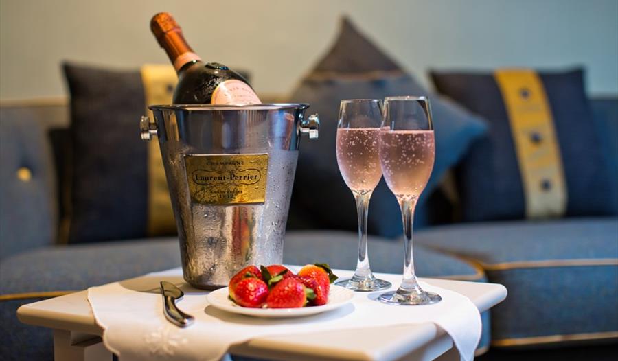 A table set up with champagne for two.