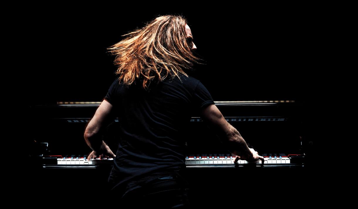 Tim Minchin on stage