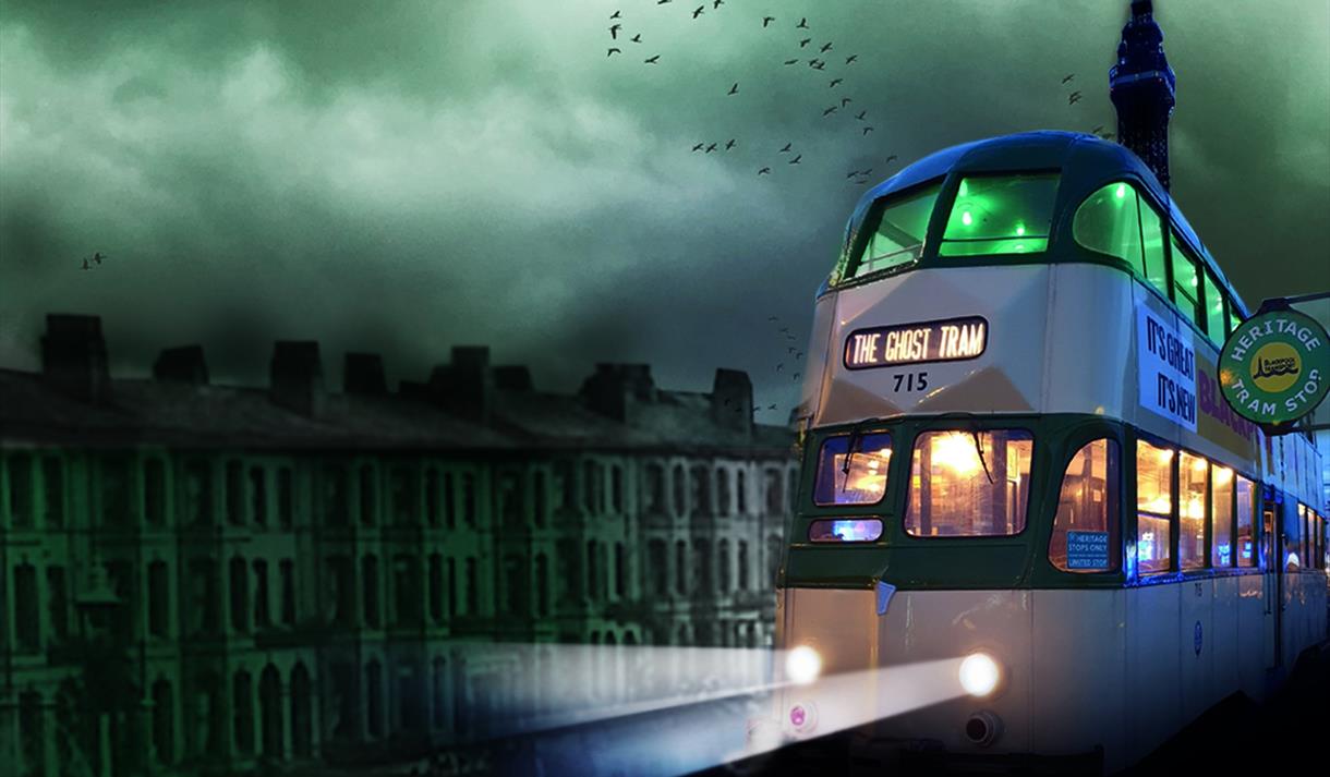 A heritage tram travels through Blackpool, past the Blackpool Tower.  Headlights are on and spooky bats fly in the eyry sky.