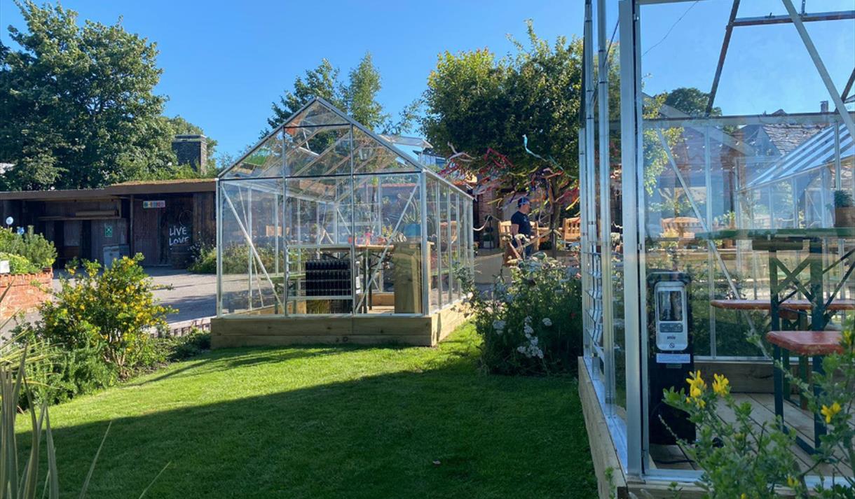 Green houses at Cartford Inn