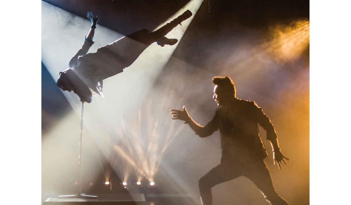 Dramatic image of the performance in the spotlight of the theatre.