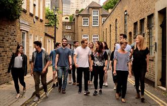 A dozen performers walk through the streets of Lancaster city.  Image credit Eliza Brown