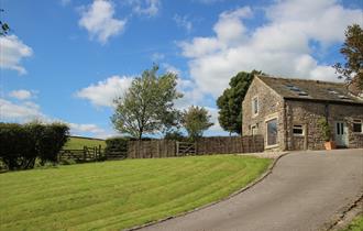 Image of outside the barn on a sunny day.