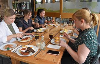 Ladies enjoy a coffee and a catch up in the cafe.