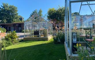 Green houses at Cartford Inn