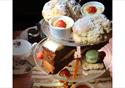 Afternoon tea table display with three tiers of treats.