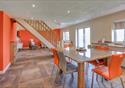 Open living space decorated in orange and white