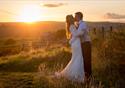 Kissing couple in front of sunset