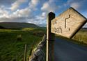 sign post with Pendle Hill in the background