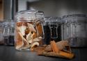 herbs and spices in glass jars