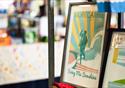 A print of the Eric Morecambe statue and the word Bring Me Sunshine, sit in a black picture frame on a stall at Festival Market