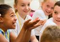 Children watch an experiment in fascination.