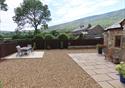 The surrounding grounds of the cottages with an outside dining area all overlooked by the Lancashire rolling countryside.