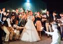 Bride and guests posing with sparklers