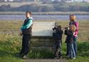 Family at information board