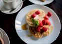 Pancakes served with raspberries