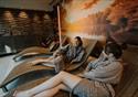 Friends relaxing on the indoor loungers