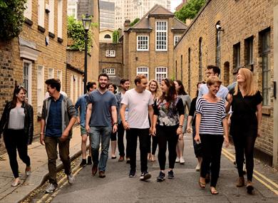 A dozen performers walk through the streets of Lancaster city.  Image credit Eliza Brown