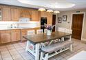 The spacious kitchen with seating area for guests to spend time together.