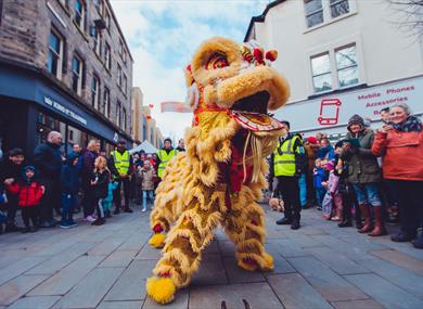 A Chinese lion takes a breather at Horseshoe Corner during last year's New Year Festival in Lancaster