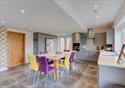 Dining kitchen with yellow and purple chairs