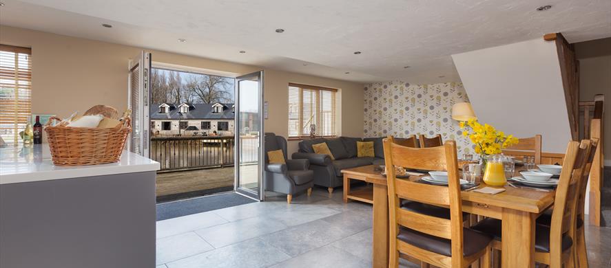 Open living space decorated in orange and white