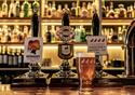 Picture of the bar at Coach and Horses showing the ale available, including local brewer Moorhouses' Blond Witch.