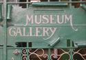 Museum sign in green