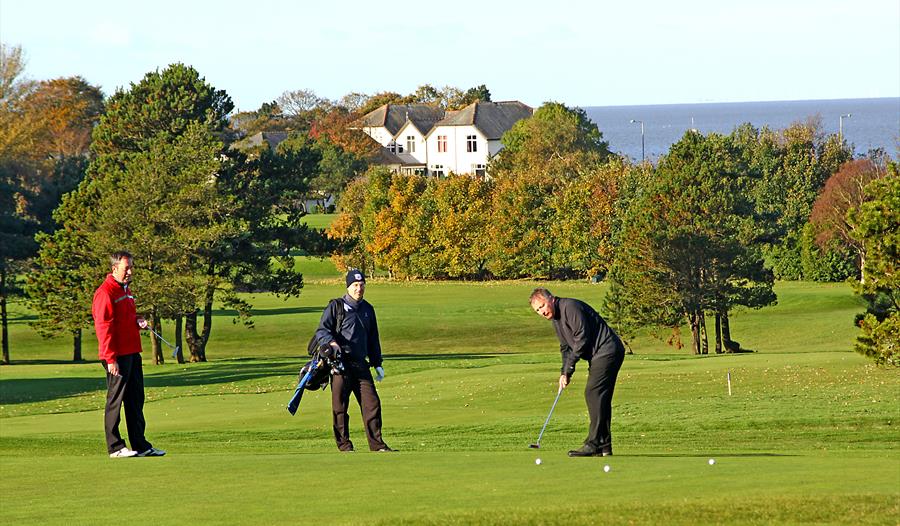 Playing golf at Morecambe Golf Course