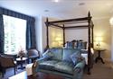 Double bed with four poster bed at The Villa Country House Hotel