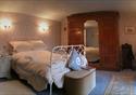 A double bedroom with a comfortable double bed awaiting guests.
