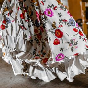 White dress with ruffles and bright flowers