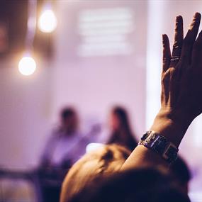 Hand raised to ask a question