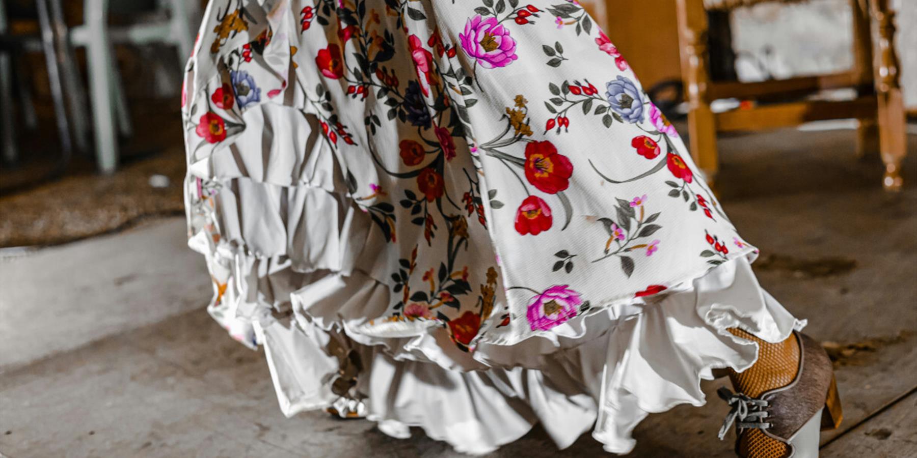 White dress with ruffles and bright flowers