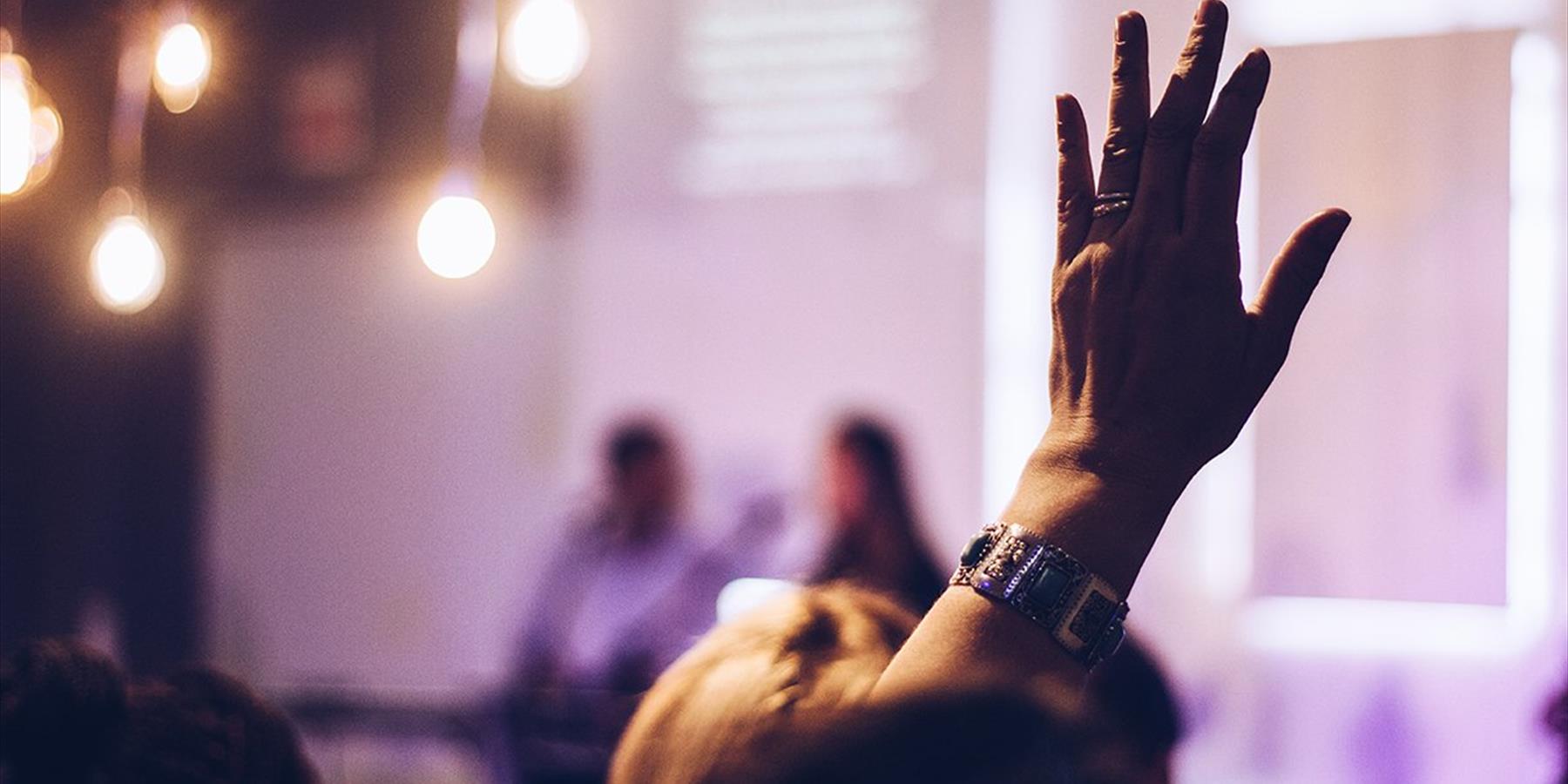 Hand raised to ask a question