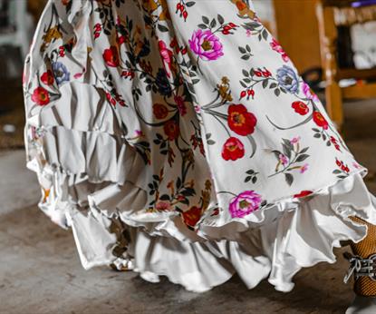 White dress with ruffles and bright flowers