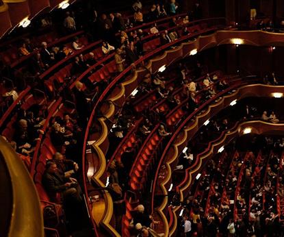 Audience sitting in a performance theatre