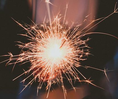 Person holding white sparkler