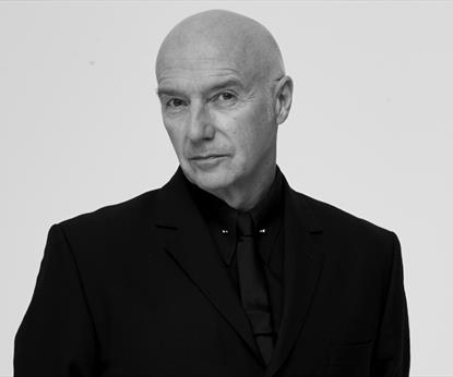 A man in a black suit