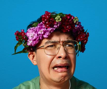 A man with flowers in his hair
