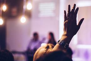 Hand raised to ask a question