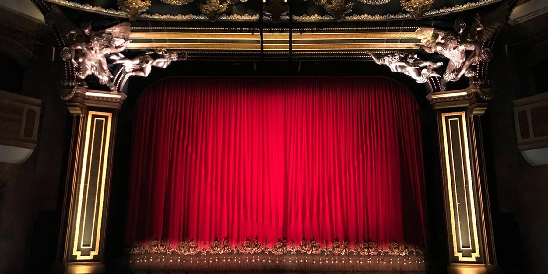 Red curtain at a performance theatre