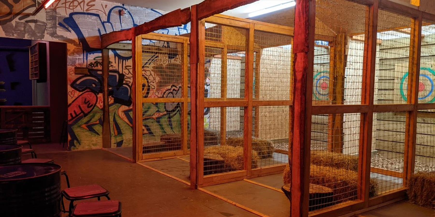 Axe throwing targets in cages