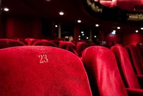 Red numbered seats at a theatre