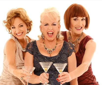 Three ladies with cocktail glasses