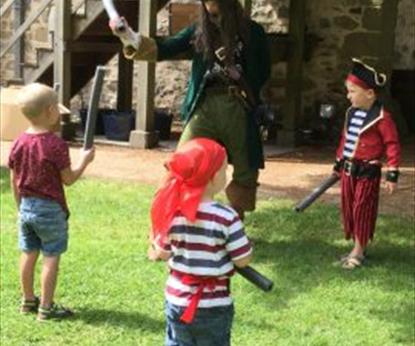 Adults & children dressed as pirates
