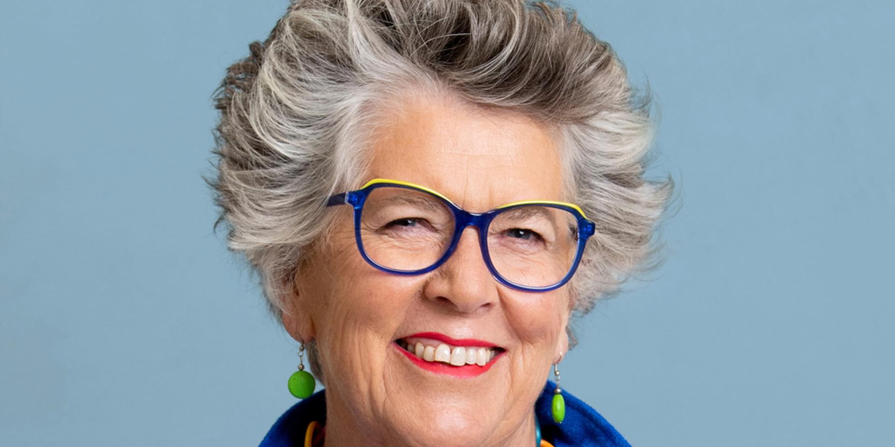 A lady with bright blue glasses