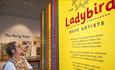woman enjoying ladybird book exhibition