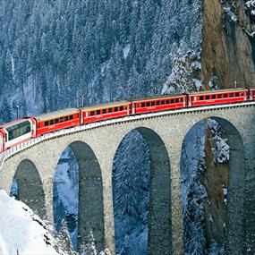 Train on a bridge in the mountains